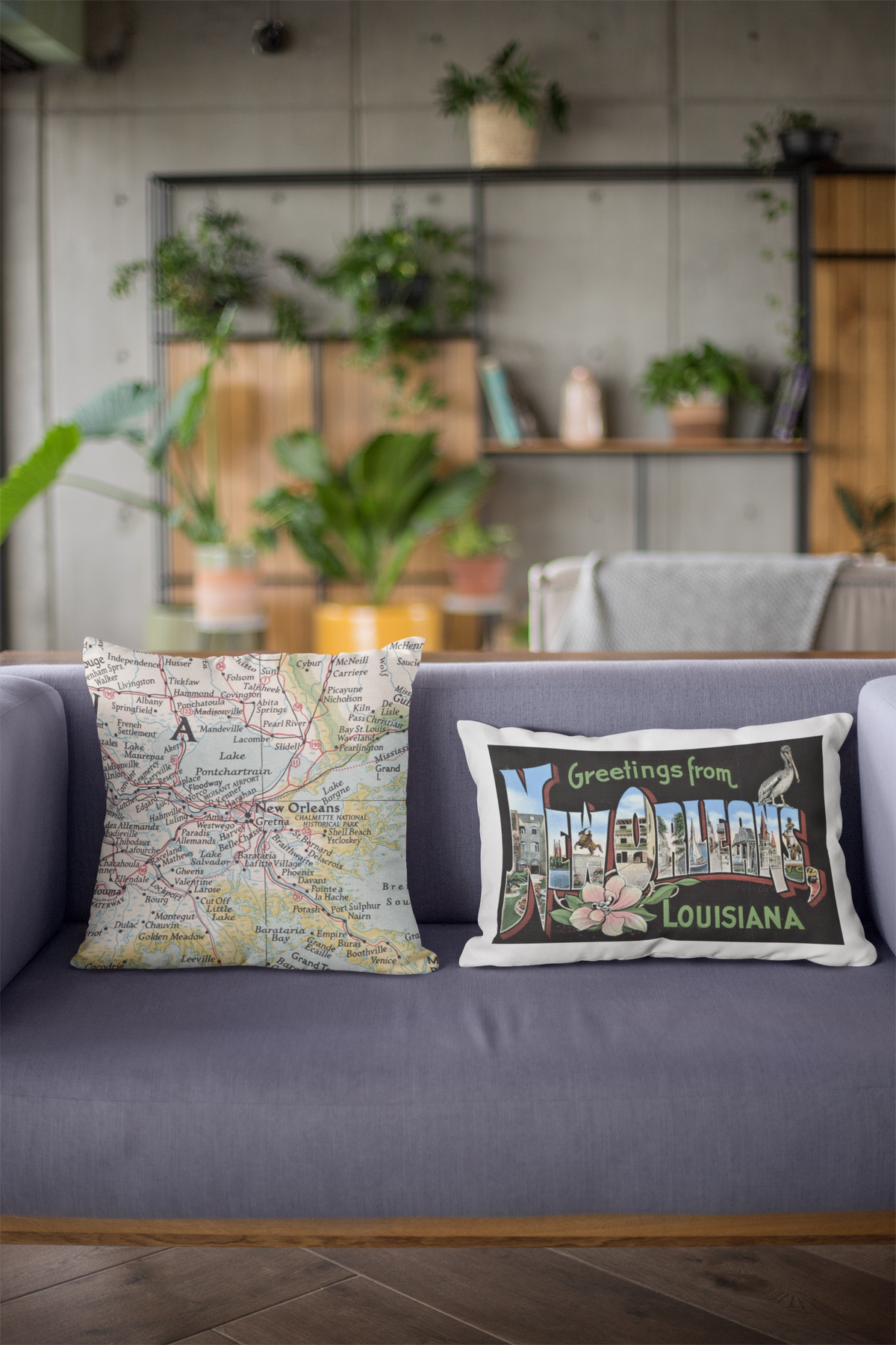 Vintage map pillows on a gray sofa