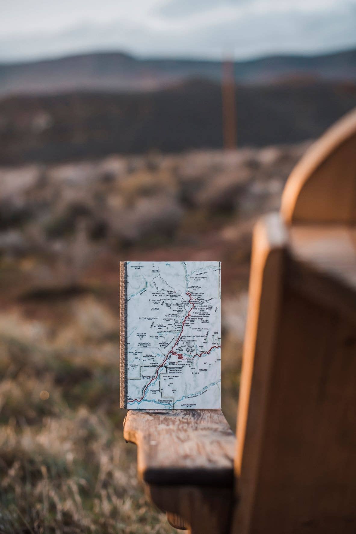 Vintage map journal on a camp chair
