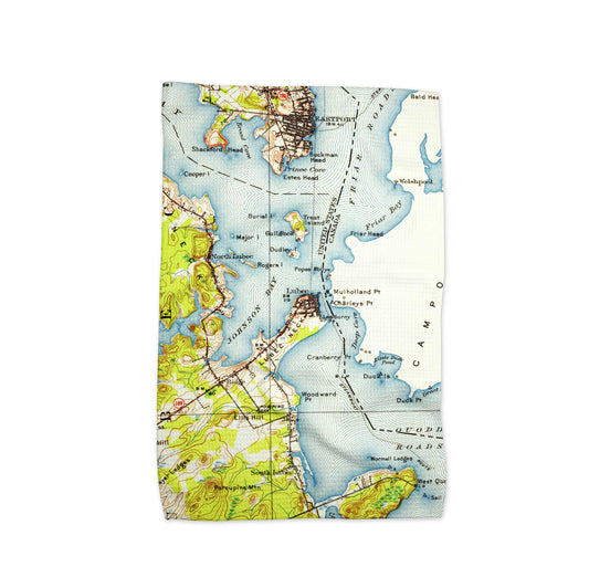 Kith towel featuring a vintage map of Lubec Maine with green land, blue coastal waters, and nearby Eastport on a white background.chen